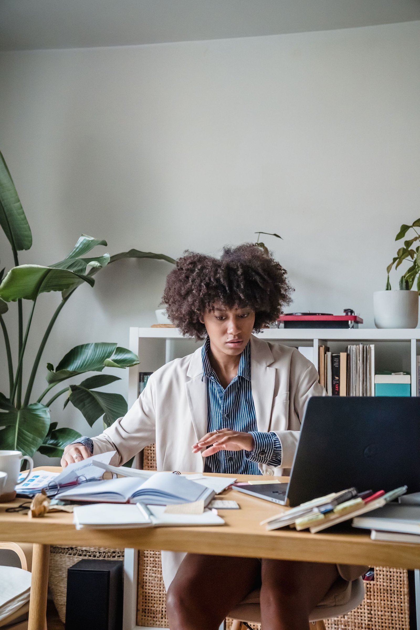 A woman reading at her desk